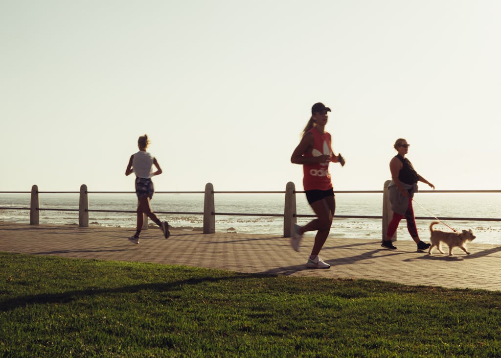 Active various women with dog on seafront